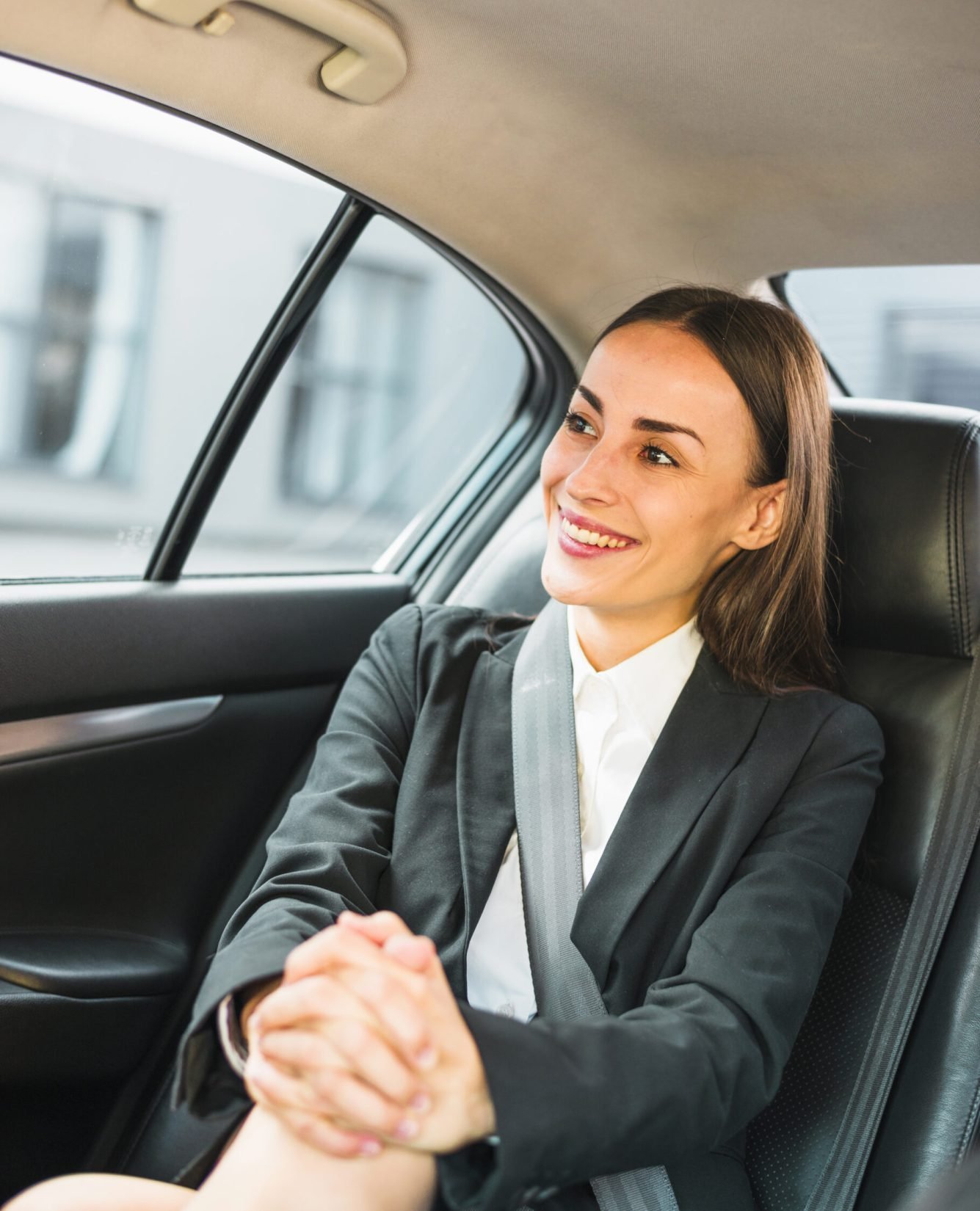 portrait-smiling-businesswoman-sitting-inside-car